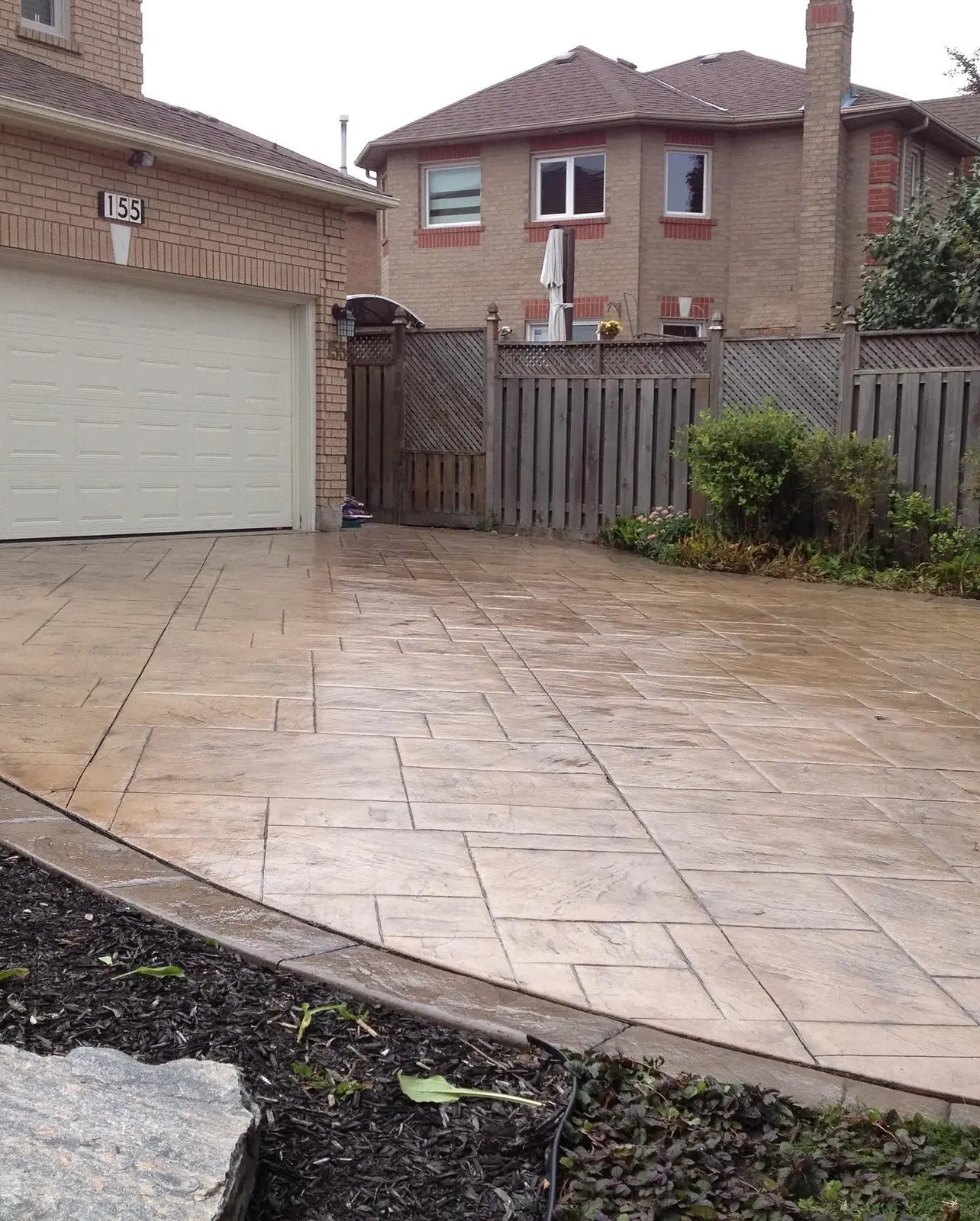 Patterned concrete driveway after cleaning and sealing